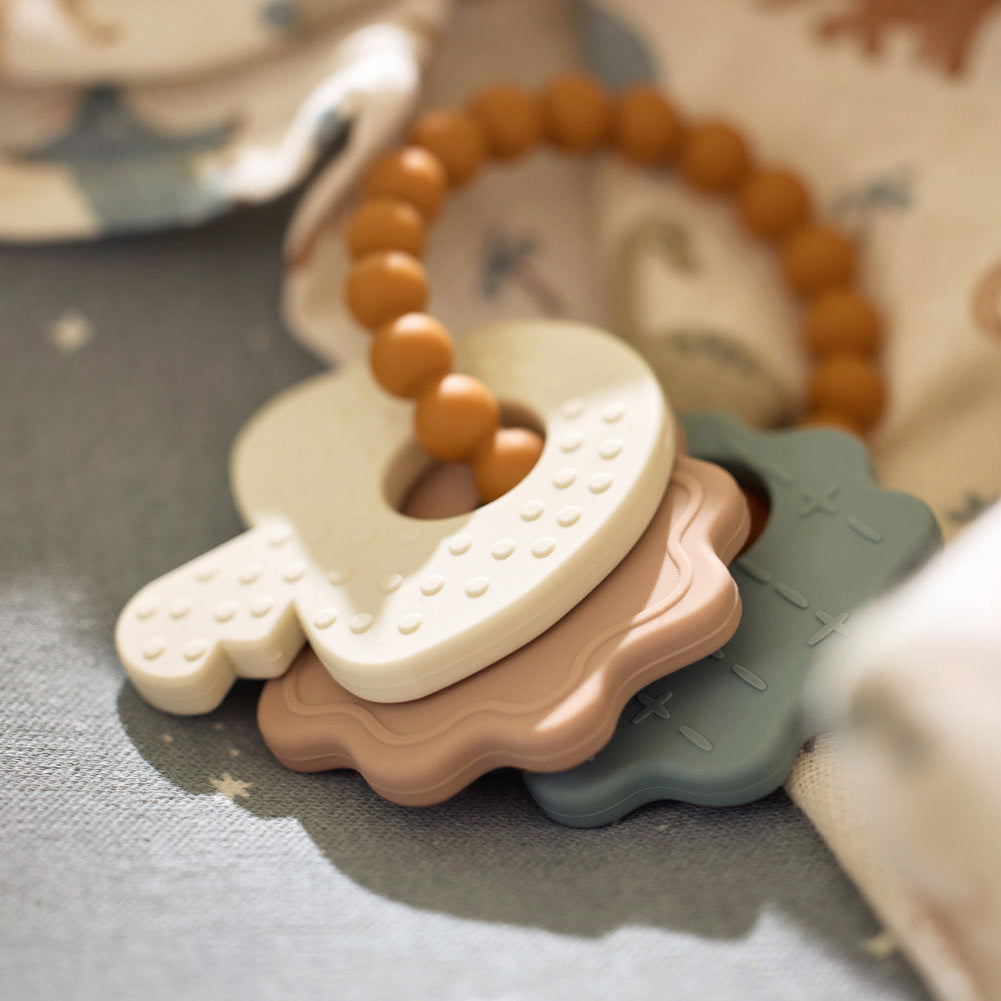 jouet sensoriel silicone teething toy keychain pastel
jouet soulagement dents bébé